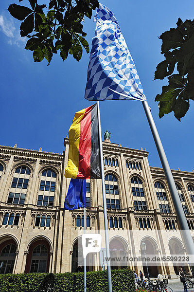 Flags flying in front of the building of the Government of Upper Bavaria  Maximilianstrasse street  Munich  Bavaria  Germany  Europe