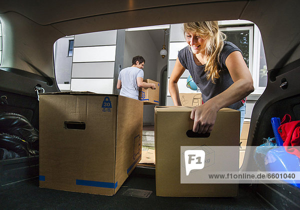 Private relocation  friends helping to unload a car