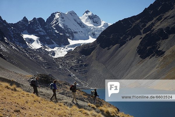 Trekkers With Condorri Peak Behind