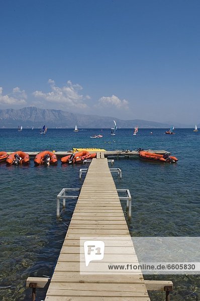 Pier And Boats At Resort On Lefkas.