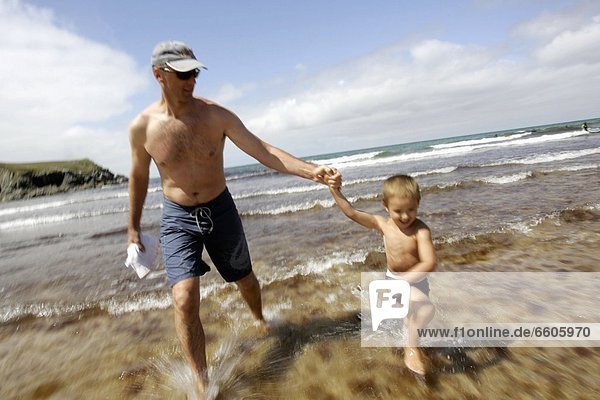 Father With Son On The Beach