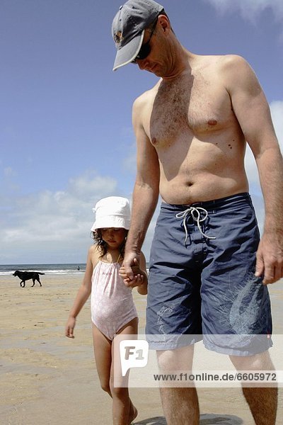 Father With Daughter On The Beach