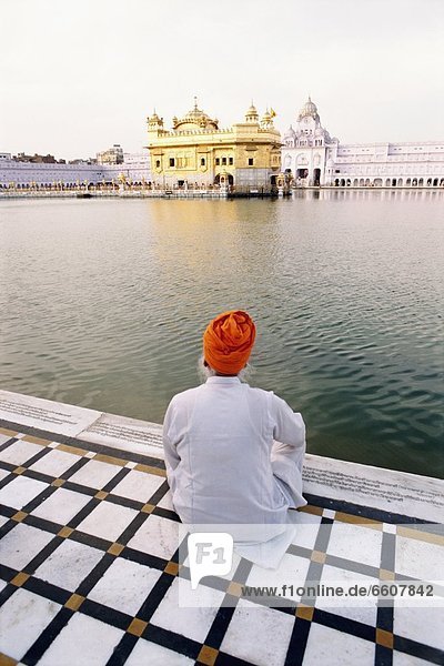 Sikh Man Sitting Outside Golden Temple