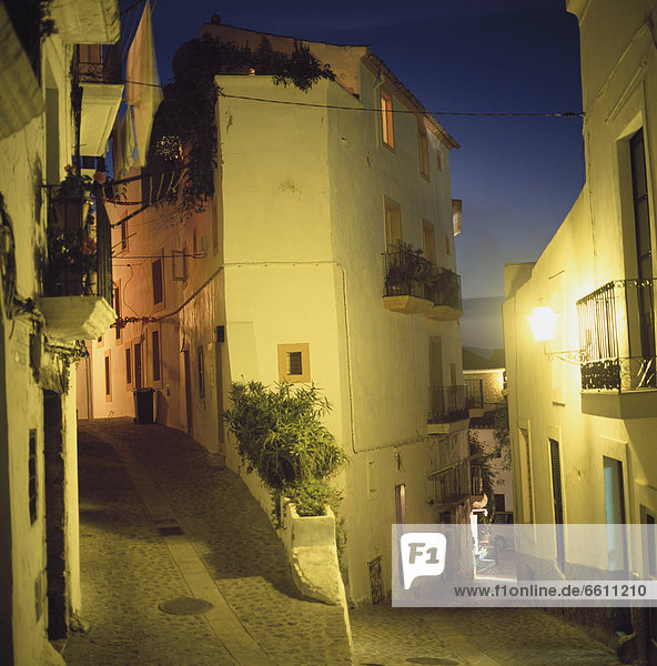 Streets In Ibiza Old Town Illuminated At Dusk