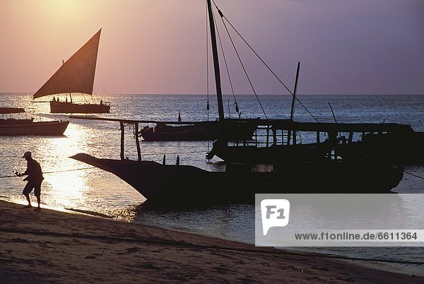 Silhouette of fisherman on Stone Town Beach
