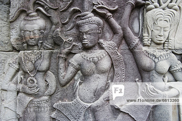 Ornate carvings on walls of Bayon temple  Angkor Siem Reap Cambodia