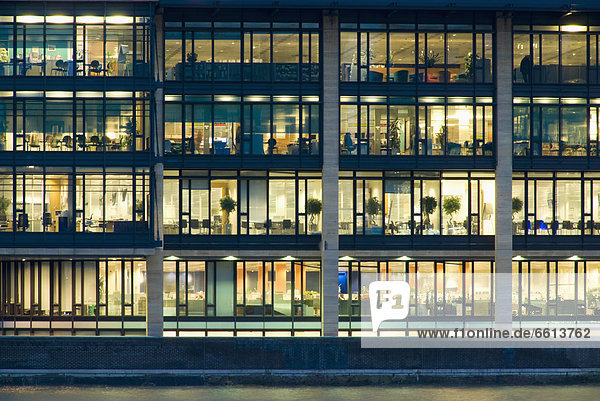 Office building exterior illuminated at dusk full frame  London England UK