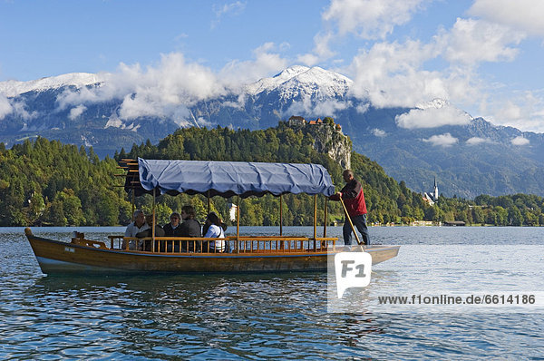 Tourists on Pletna boat  Lake Bled Gorenjska Region Slovenia
