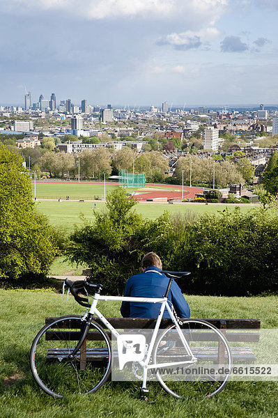 Cyclist Enjoying The View Of London From Parliament Hill In Hamstead Heath  London  Uk © Dosfotos / Axiom