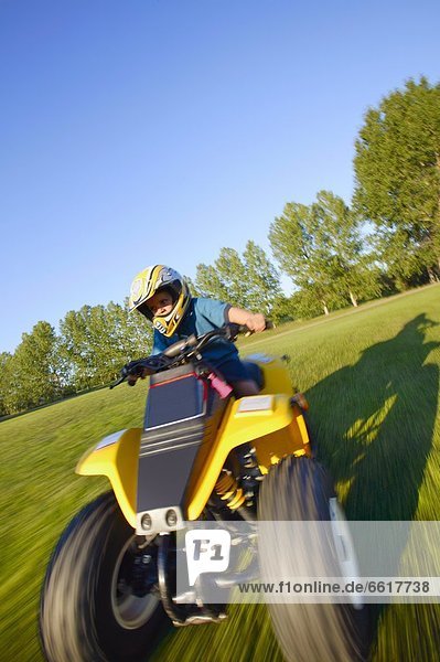 Child Rides A Quad