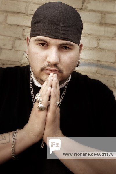 Portrait Of A Man Wearing Gang Culture Clothes