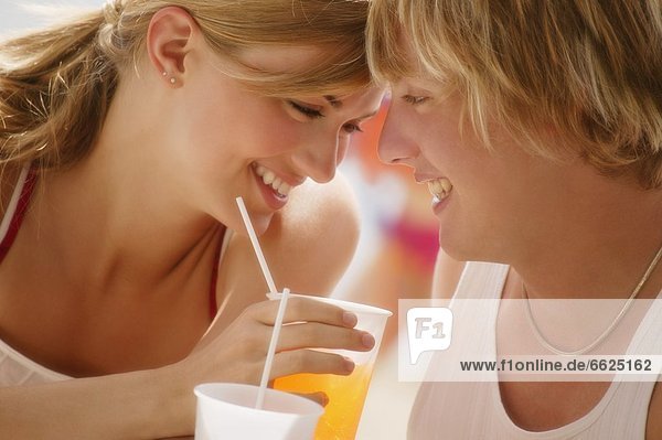 Couple Drinking On Hot Day