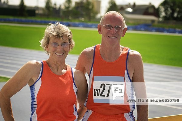 Two Senior Athletes At The Track