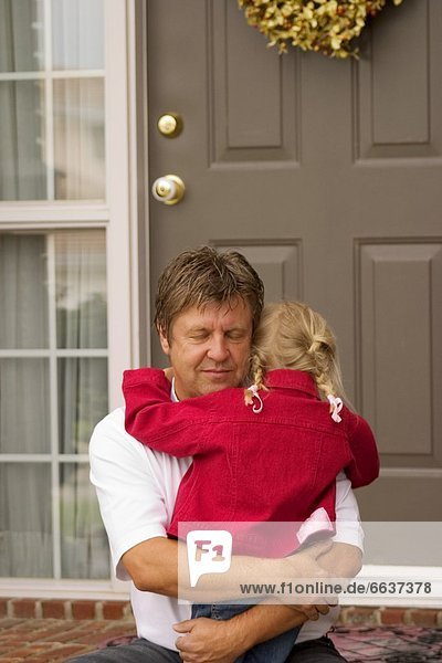 Father Hugs Daughter