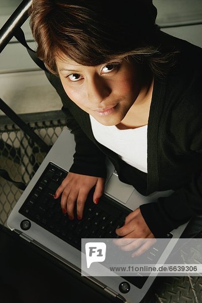 Young Adult Using A Laptop Computer
