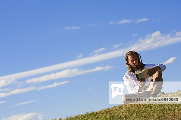 Man Reading Outdoors