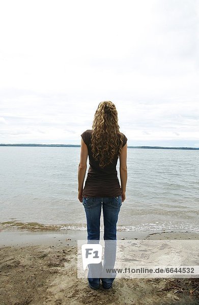 Young Woman Standing On Shore