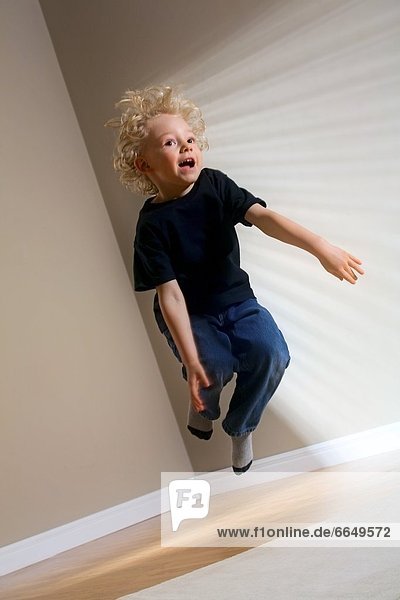 A Boy Jumping In The Air