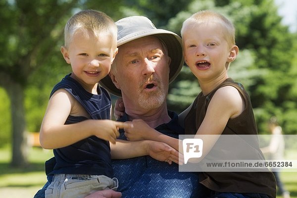 Portrait Of A Grandfather With Grandsons