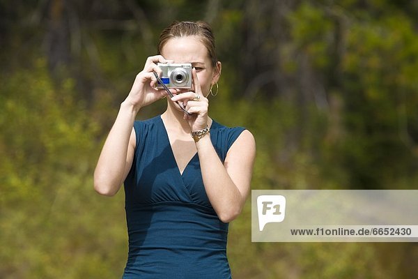 Front View Of Female Photographer