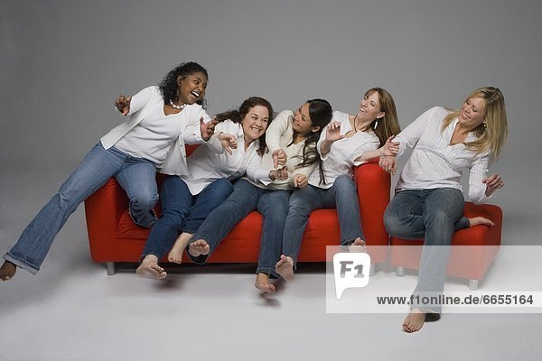 A Group Of Woman On A Couch