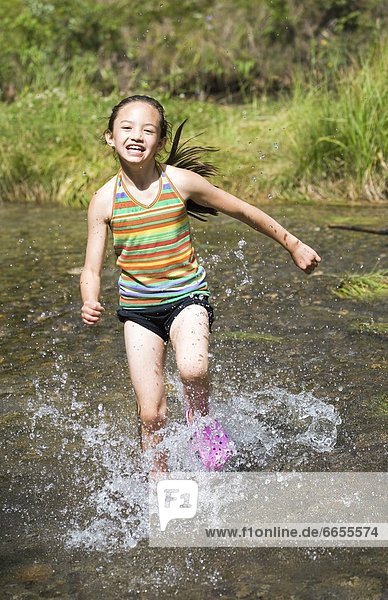 Girl Running Through Water