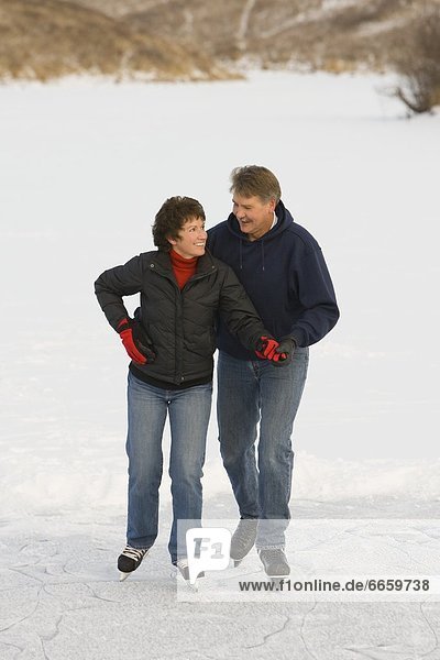 Couple Ice Skating Together