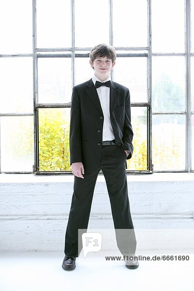 Boy Dressed In Tuxedo