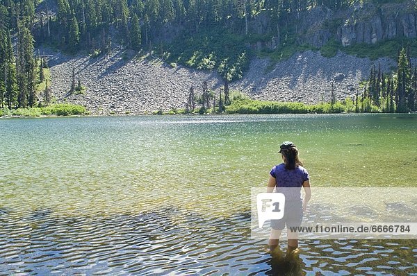 Woman Wading In Water  Boulder Lake  Mount Hood National Forest  Oregon  Usa