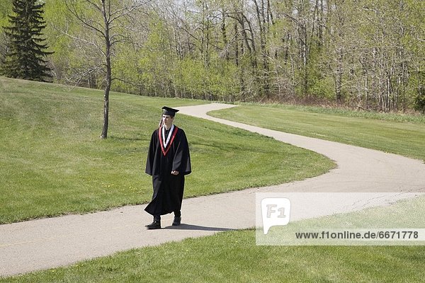 Graduate Walking A Path