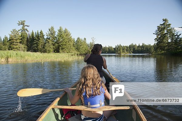 Two People On A Canoe  Lake Of The Woods  Ontario  Canada