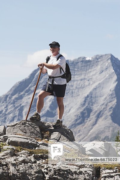 Man Standing On A Mountain