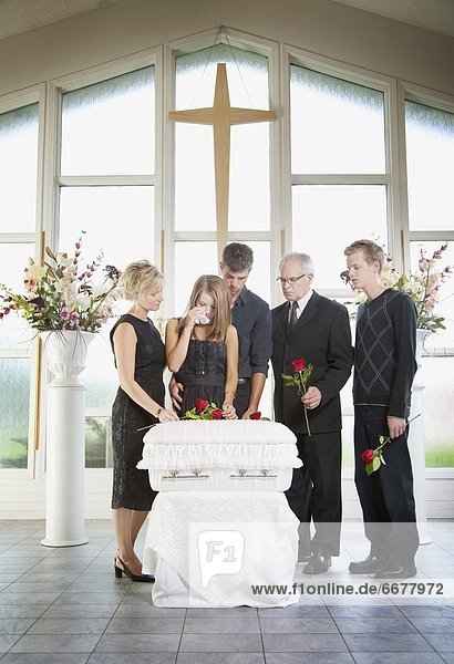 A Family Gathered Around An Infant's Coffin