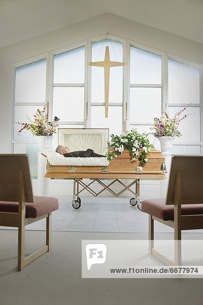 The Deceased Laying In A Coffin At A Funeral Home