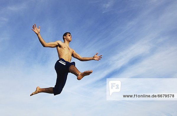 Young Man Jumping In The Air