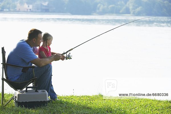 A Father And Daughter Fishing