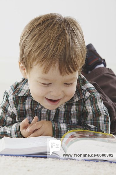 A Young Boy Reading His Bible