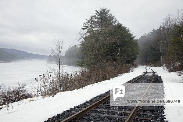 Train Tracks In Snowy Landscape