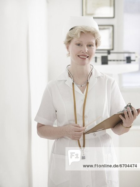 Female nurse with clipboard