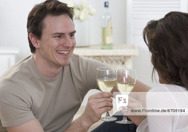 Couple with glasses of white wine