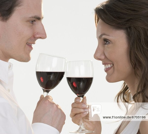 Profile of couple with red wine