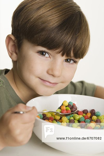 Portrait of boy eating cereal