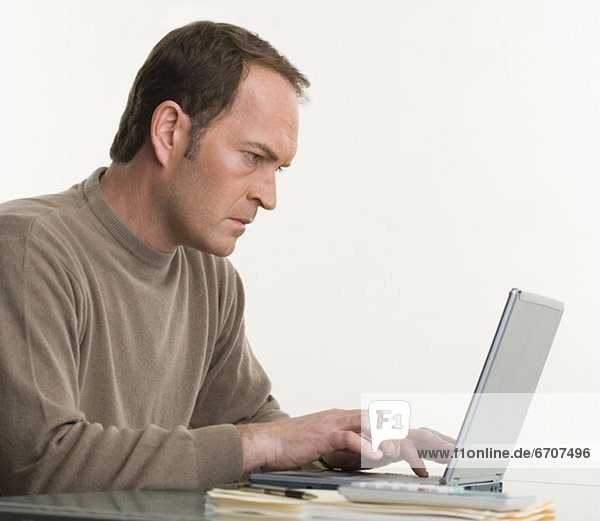 Portrait of a man at his computer