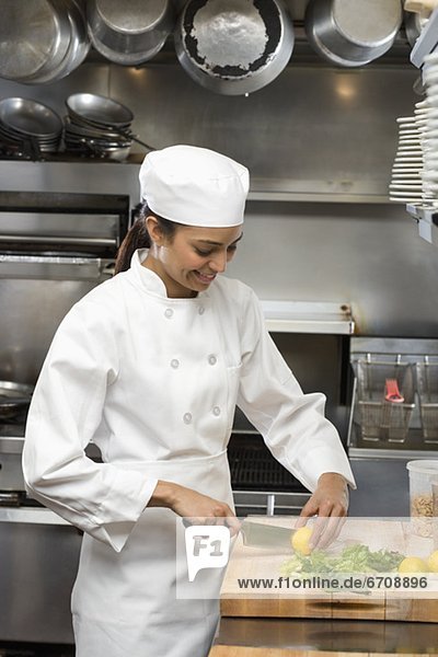 Female chef in restaurant kitchen