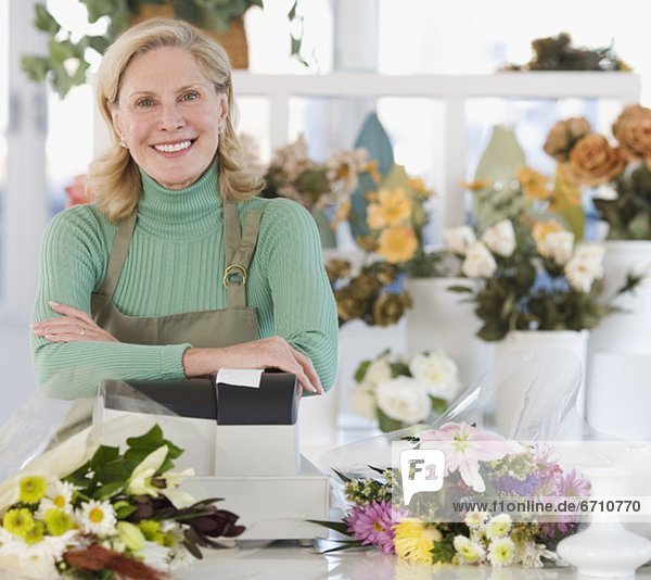 Portrait of female florist at cash register