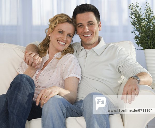 Portrait of couple on sofa