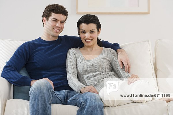 Portrait of couple on sofa