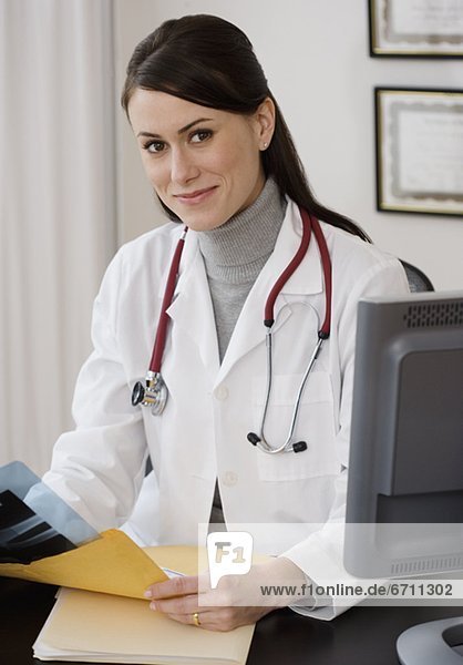 Portrait of female doctor in office