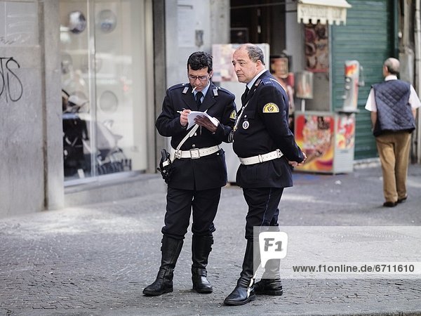 'Two Middle-Aged Policemen On Street