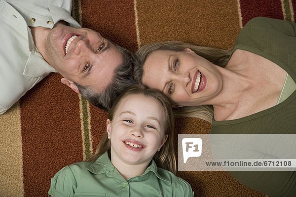 High angle view of family on floor